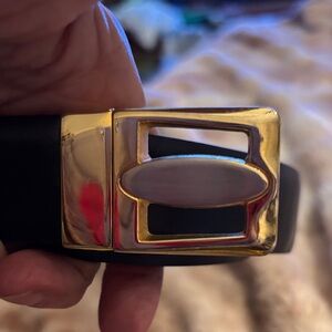 Sophisticated Black and Brown Belt with Gold Buckle Turns and you have 2 belts